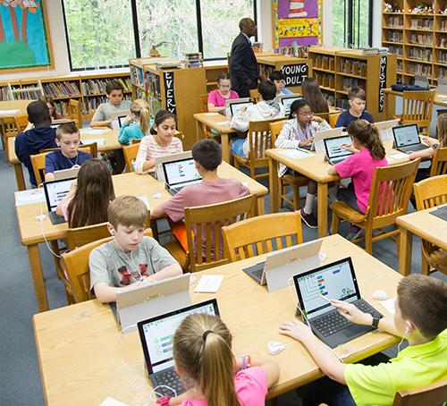 Students taking digitally based assessments.